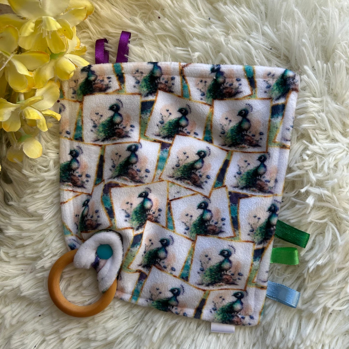 Doudou étiquette paon