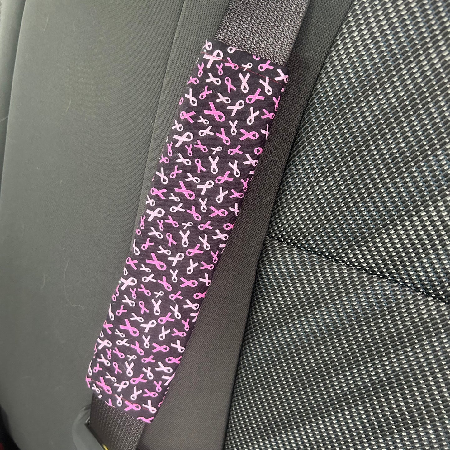 Protège ceinture ruban rose