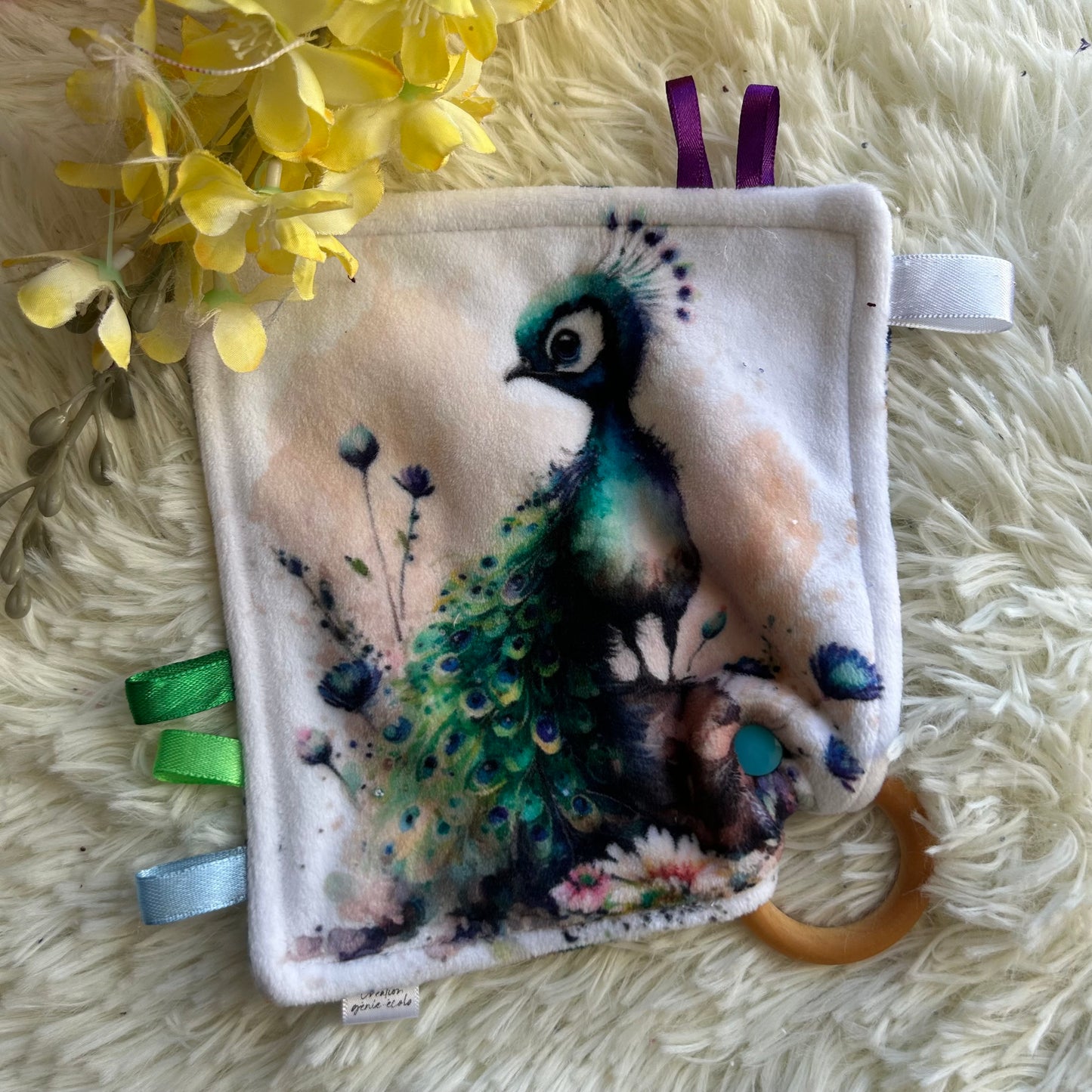 Doudou étiquette paon