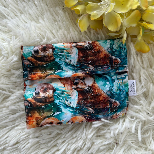 Pochette pour serviette hygiénique loutre